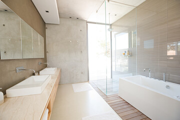 Fototapeta na wymiar Shower and bath in modern bathroom