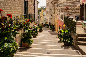 View on the beautiful staircase with flowers of Numana, Riviera del Conero, Marche - Italy