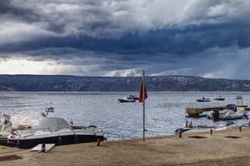 dramatic sky over boats in the adriatic sea 