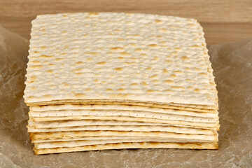 A lot of traditional Jewish matzoh lies on paper.