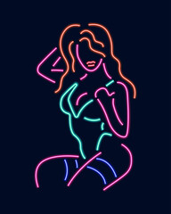 Obraz na płótnie Canvas Neon silhouette of girl isolated on dark background.