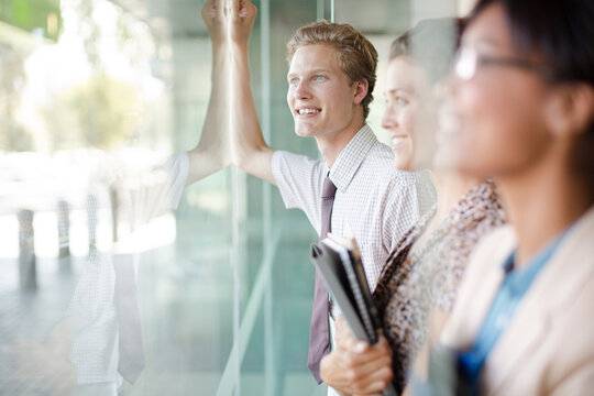 Business People Looking Out Office Window