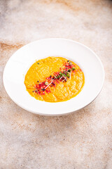 pumpkin cream soup puree fresh portion ready to eat meal snack on the table copy space food background rustic. top view keto or paleo diet veggie vegan or vegetarian food