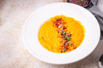 pumpkin cream soup puree fresh portion ready to eat meal snack on the table copy space food background rustic. top view keto or paleo diet veggie vegan or vegetarian food