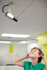 Businesswoman making face at security camera