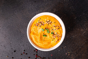 pumpkin cream soup puree fresh portion ready to eat meal snack on the table copy space food background rustic. top view keto or paleo diet veggie vegan or vegetarian food