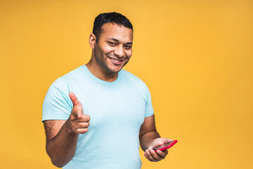 Portrait of handsome excited cheerful joyful indian african american guy wearing casual sending and...