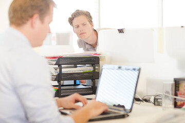 Businessman working on laptop at desk