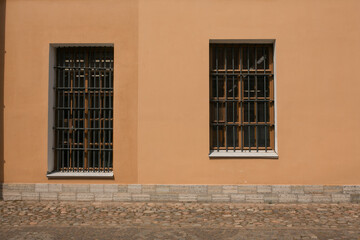 Wall and windows with bars.