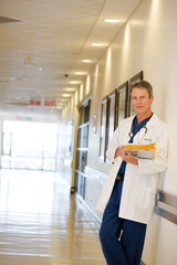 Portrait of serious doctor in hospital corridor