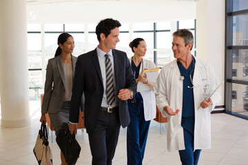 Doctors talking in hospital corridor