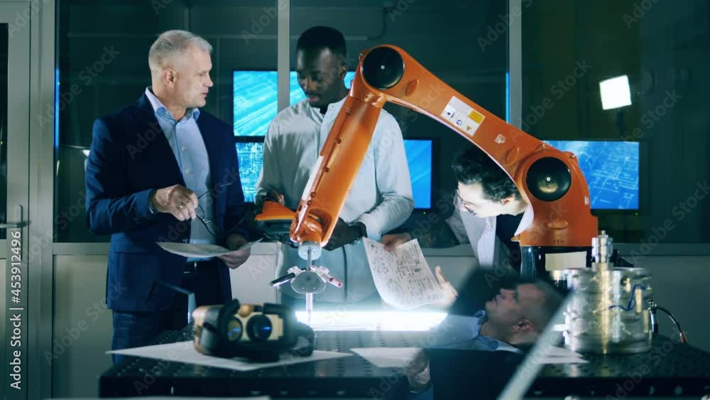Wall mural robotics engineers are studying cybernetic devices