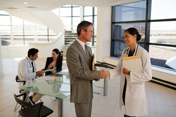 Businessman and doctor talking in meeting