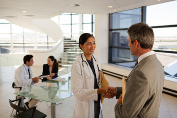 Fototapeta premium Portrait of smiling doctors and businessman