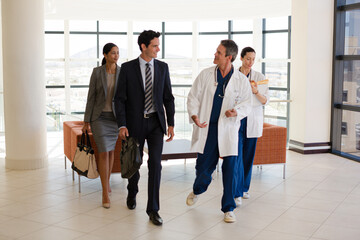 Doctors talking in hospital corridor