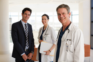Doctor and businessman shaking hands in meeting