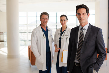 Portrait of serious doctor in hospital corridor