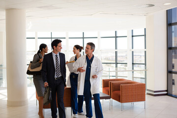 Doctors talking in hospital corridor