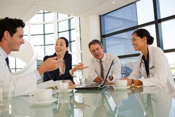 Fototapeta premium Portrait of smiling doctor in hospital corridor