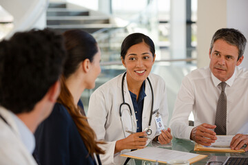 Doctors rushing down hospital corridor