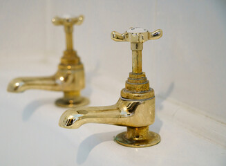 pair of vintage bathroom brass taps