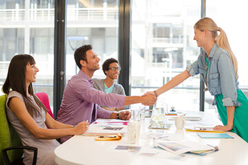 Business people shaking hands in meeting