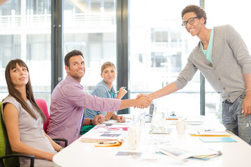 Business people shaking hands in meeting