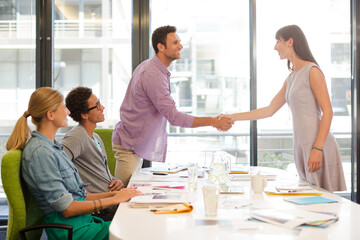 Business people shaking hands in meeting