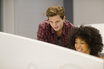 Business people working on computer at desk