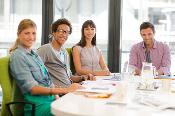 Portrait of business people smiling in meeting