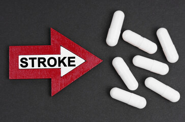 Tablets are on a black background. They are indicated by an arrow on which it is written - STROKE