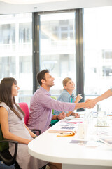 Business people shaking hands in meeting