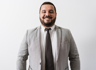 Young Latino businessman or lawyer on white background.