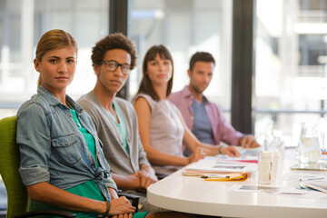 Portrait of business people smiling in meeting