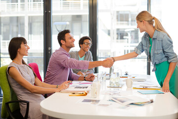 Business people shaking hands in meeting