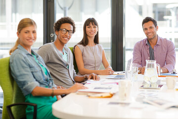 Portrait of business people smiling in meeting