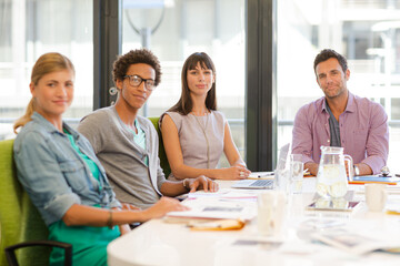 Portrait of business people smiling in meeting