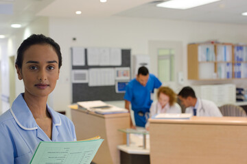 Nurse standing in hospital hallway