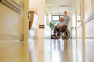 Nurse with older patient in hospital