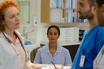 Fototapeta premium Hospital staff talking at front desk