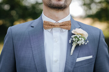 Groom wearing a bowtie made of cork