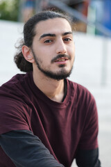 Obraz premium Close up portrait of handsome Arab man walking in the park