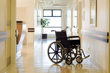 Fototapeta na wymiar Empty wheelchair in hospital hallway