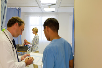 Fototapeta premium Doctors standing in hospital room