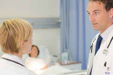 Fototapeta premium Doctor checking syringe in hospital room