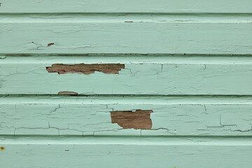 Peeling and cracked paint on wood panelling background with copyspace