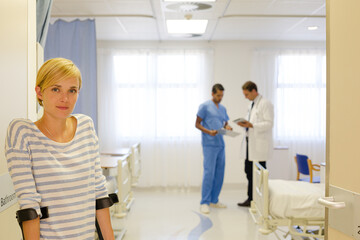 Fototapeta premium Patient using crutches in hospital room