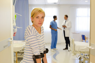 Fototapeta premium Patient using crutches in hospital room