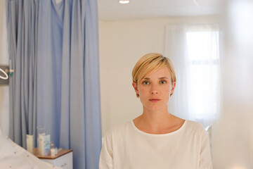 Patient sitting on hospital bed