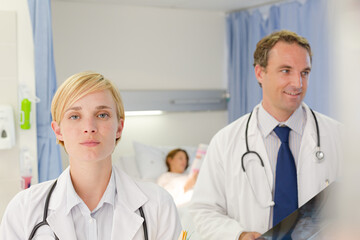 Fototapeta premium Doctors examining x-rays in hospital room
